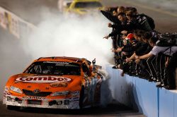 Kyle Busch celebrates his Bashas' Supermarkets 200 victory with a burnout for his Joe Gibbs Racing team. Credit: Todd Warshaw/Getty Images for NASCAR